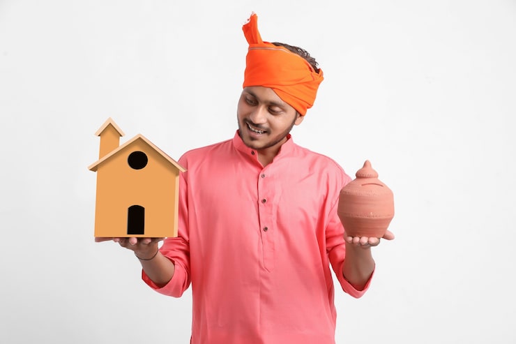 indian-man-holding-handmade-home-clay-piggy-bank-hand_54391-3265